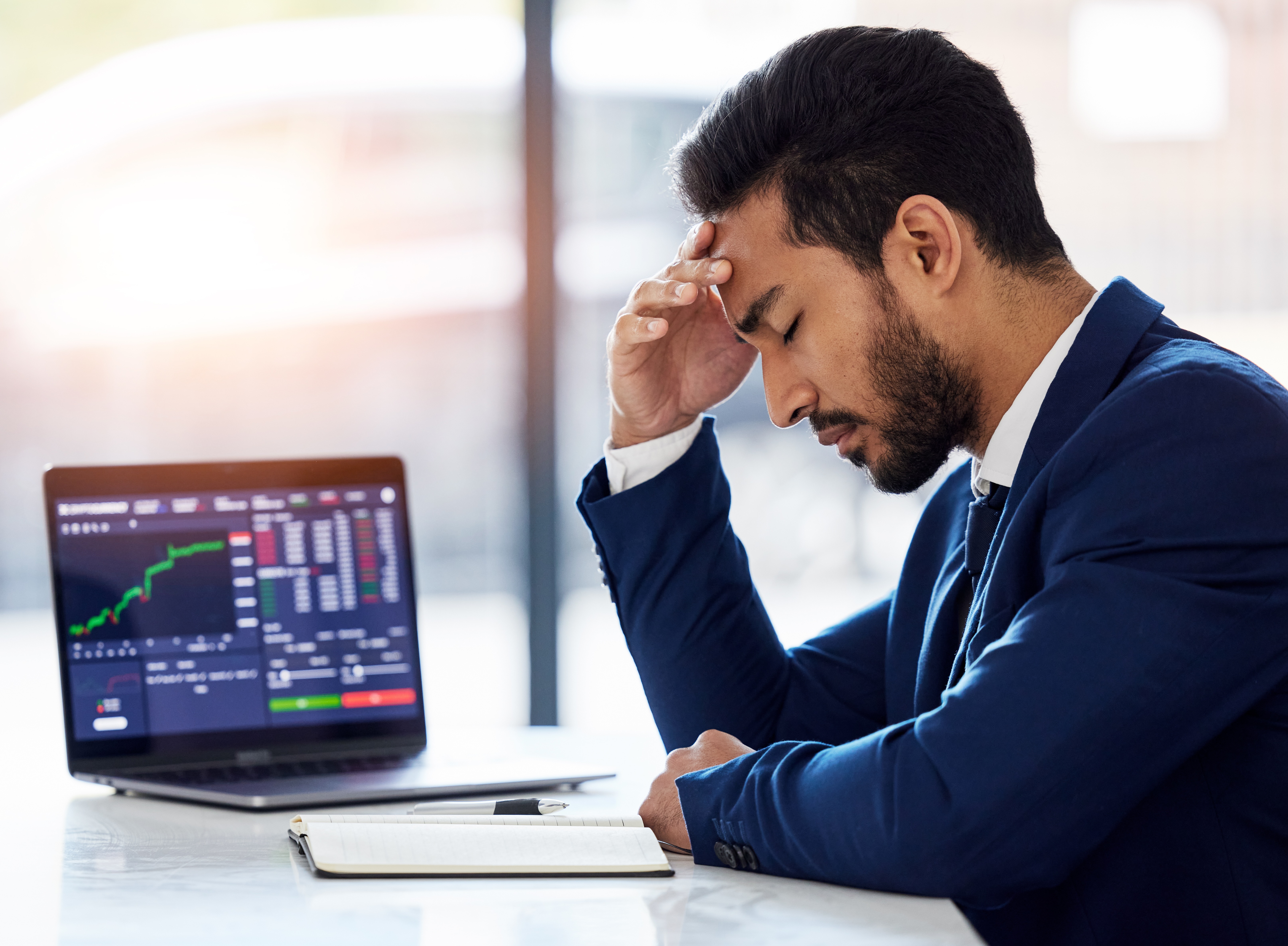 Frustrated business owner reviewing disappointing analytics data